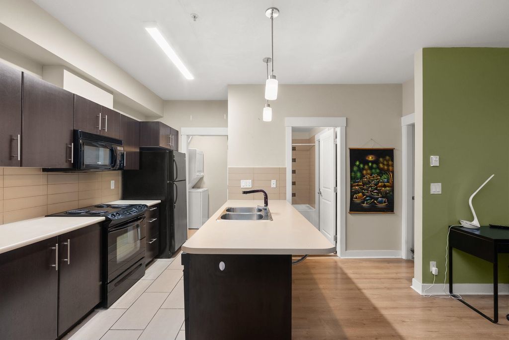 Photo of 33545 Rainbow Avenue #103, Abbotsford, BC V2S 0B9 (MLS # R3072235)