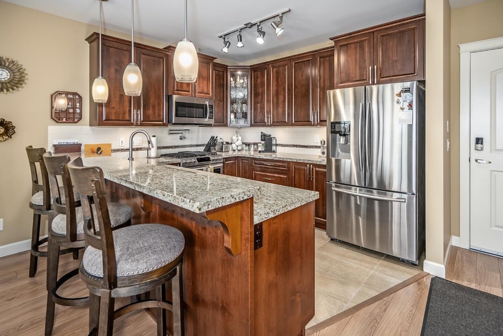 Photo of 32445 Simon Avenue #409, Abbotsford, BC V2T 5E3 (MLS # R3129724)