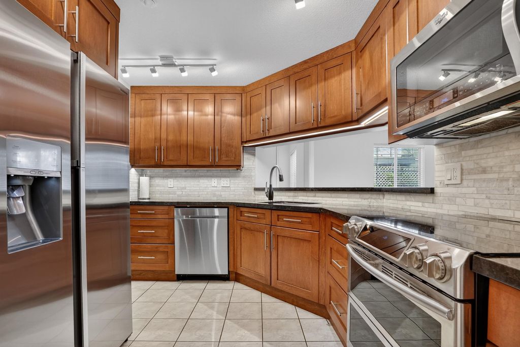 Photo of 20110 Michaud Crescent #105, Langley, BC V3A 4B1 (MLS # R3087682)