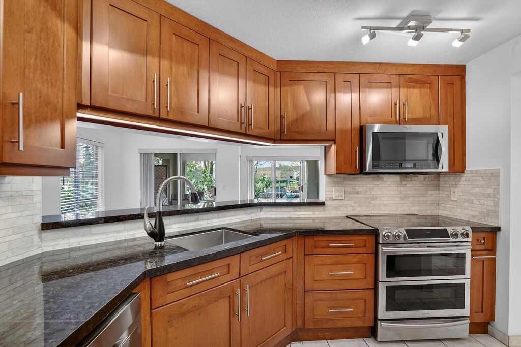 Photo of 20110 Michaud Crescent #105, Langley, BC V3A 4B1 (MLS # R3087682)