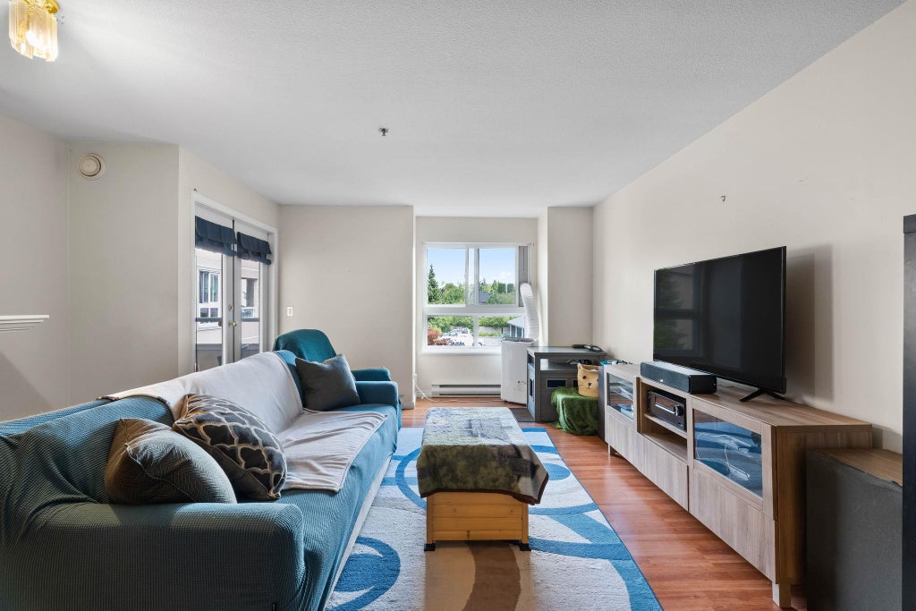 Photo of 19721 64 Avenue #302, Langley, BC V2Y 1L1 (MLS # R3163075)
