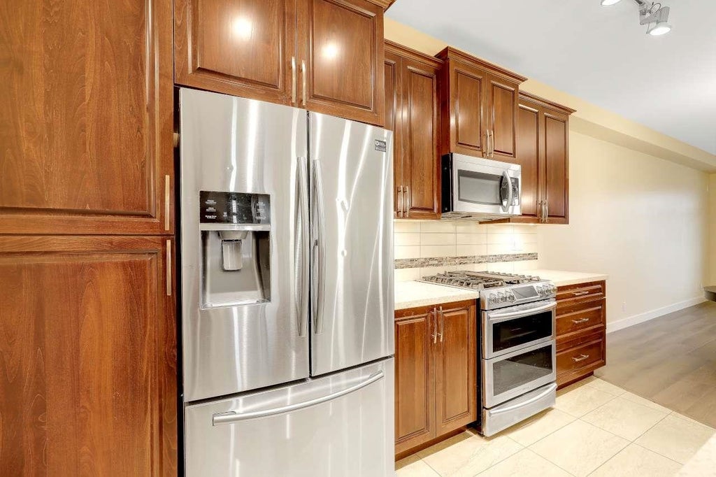 Photo of 20716 Willoughby Town Centre Drive #A303, Langley, BC V2Y 3J7 (MLS # R3160160)