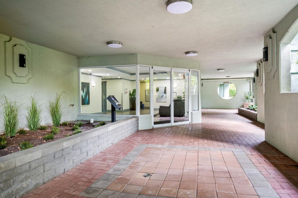 Photo of 9018 208 Street #302, Langley, BC V1M 2Y8 (MLS # R3113359)