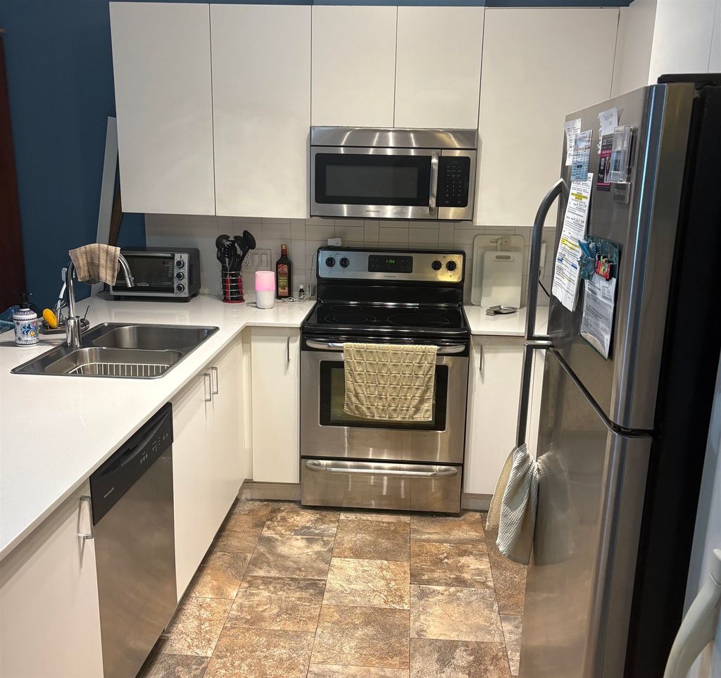 Photo of 20460 Douglas Crescent #211, Langley, BC V3A 0C6 (MLS # R3080235)