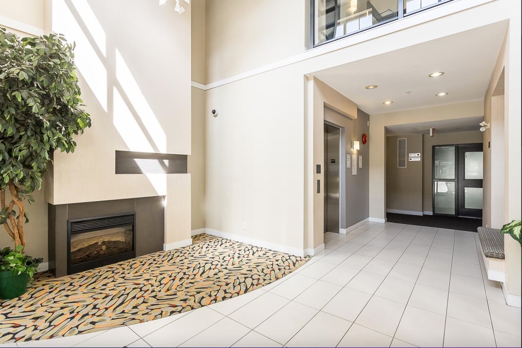 Photo of 33546 Holland Avenue #301, Abbotsford, BC V2S 0C1 (MLS # R3123931)