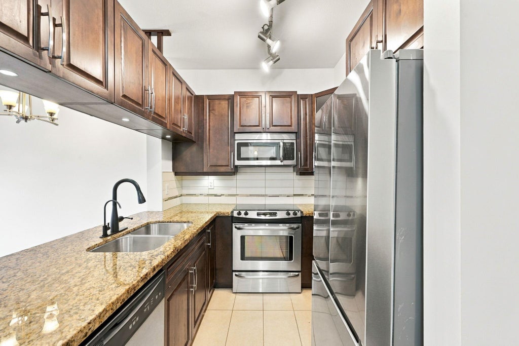 Photo of 12525 190a Street #212, Pitt Meadows, BC V3Y 0E1 (MLS # R3175958)