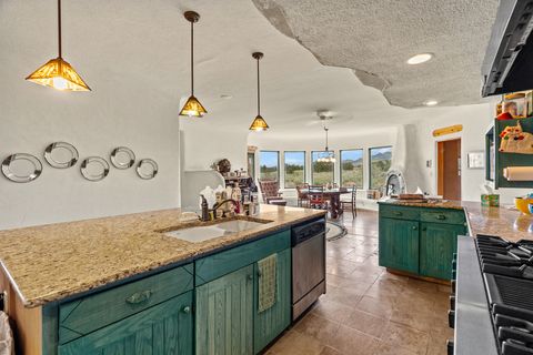 Tiny photo for 115 Waldo Mesa, Madrid, NM 87010 (MLS # 202403116)