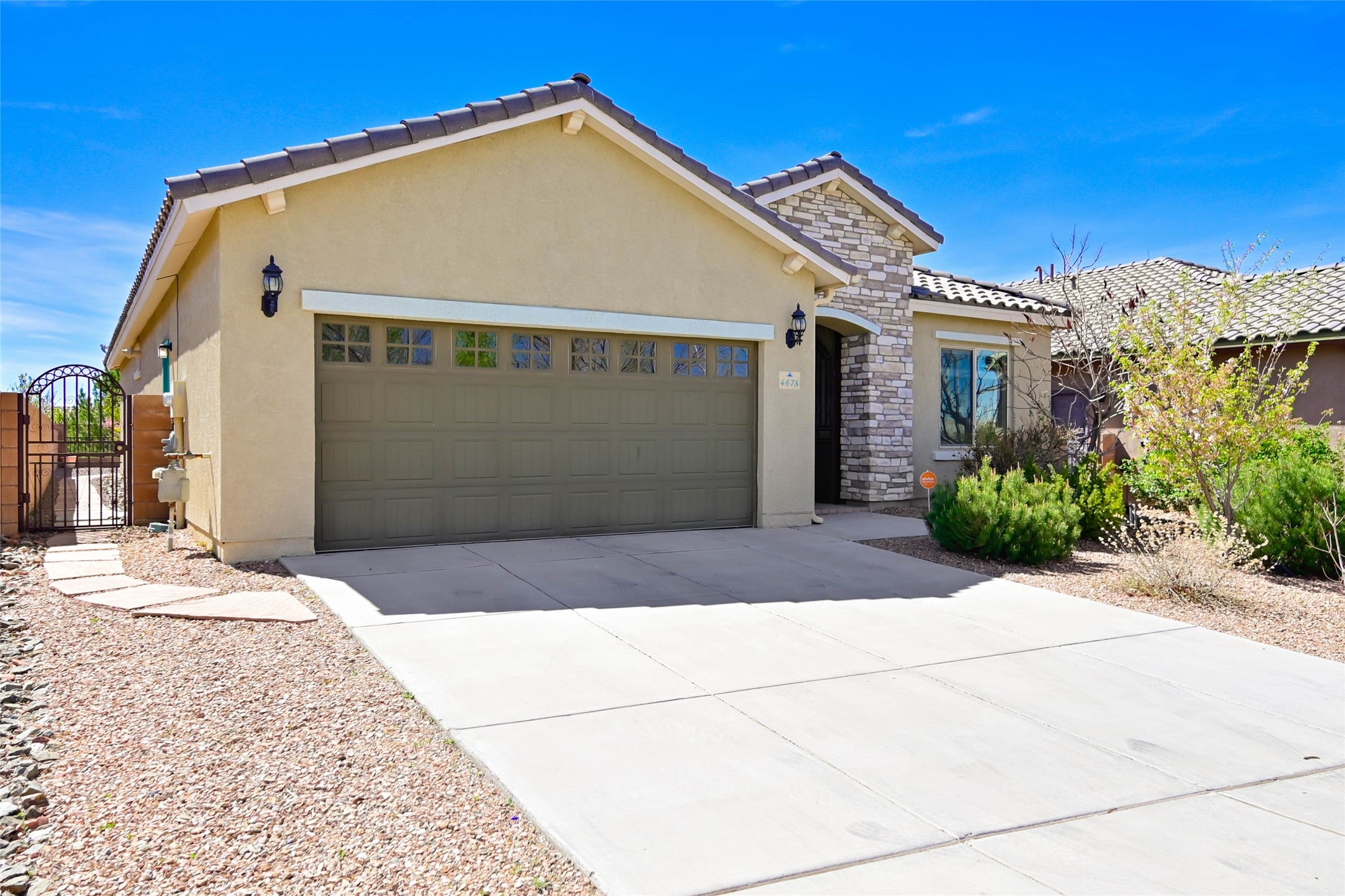 Spacious living room with windows and direct access to landscaped easy care yard