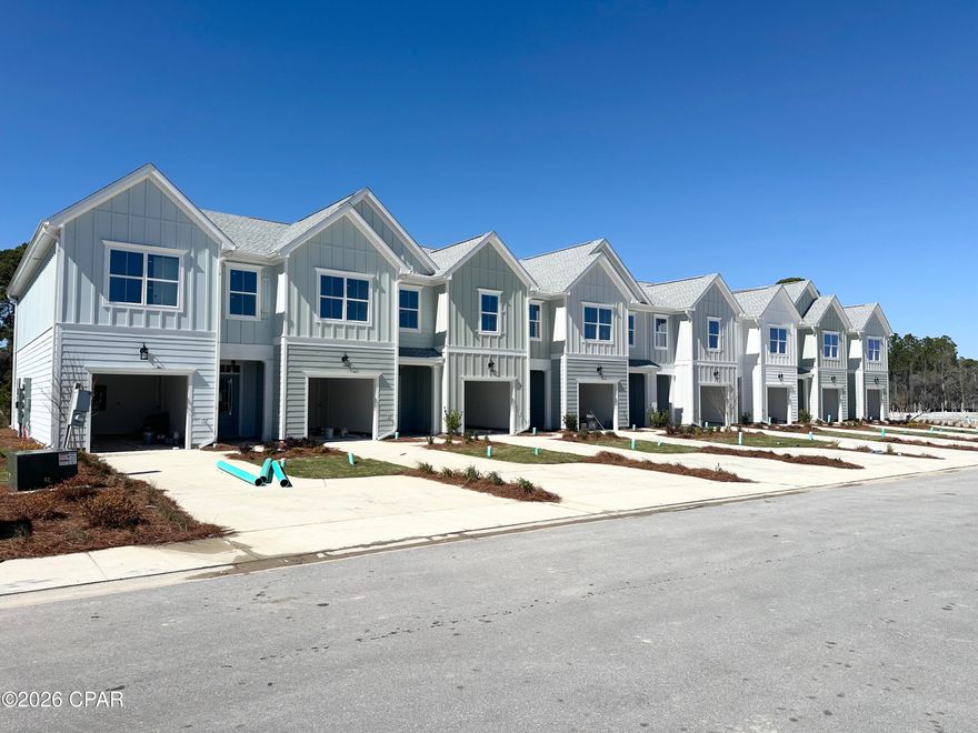 NO RENTAL RESTRICTIONS!!! Our stunning pool is NOW OPEN! The prefect place to SOAK UP THAT Florida SUN! Seagate at Clara is a new townhome community nestled in the vibrant city of Panama City Beach, FL. This two-story unit features board and batten exterior and covered entries. One car garage provides a great space for storing beach essentials. This open concept townhome boasts a stylish kitchen with white cabinets, tile backsplash, a large island with quartz counter tops - perfect for entertaining.  The elegant Owners Suite is designed with comfort in mind showcasing a large walk in closet and double- bowl vanities. Main Bath has tiled shower.  All bathrooms have quartz countertops.  LVP is located throughout the home.  The community pool features a cabana, lounging, seating and grilling stations. This community has a dedicated dog park. Seagate at Clara is in a prime location, approximately 1.4 miles to the sandy beaches and just minutes from Pier Park.