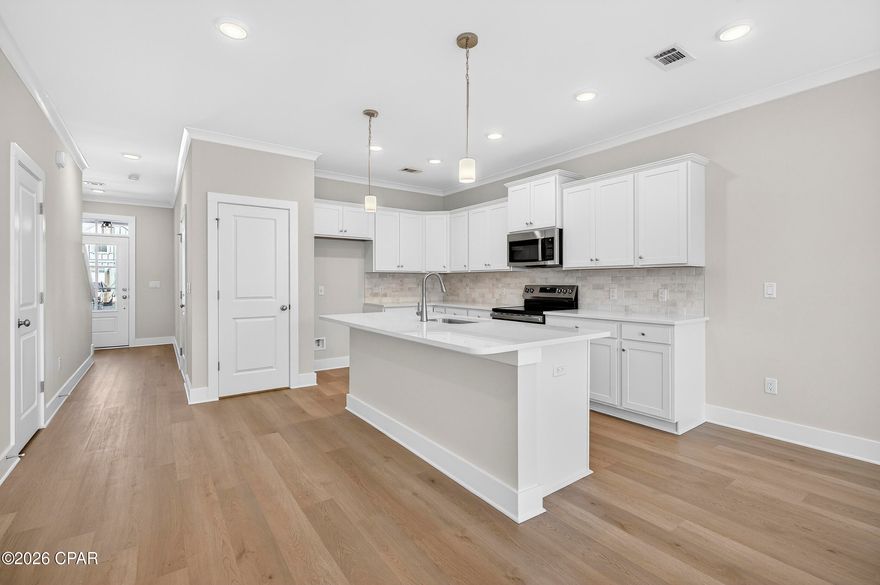 NO RENTAL RESTRICTIONS!!! Our stunning pool is NOW OPEN! The prefect place to SOAK UP THAT Florida SUN! Seagate at Clara is a new townhome community nestled in the vibrant city of Panama City Beach, FL. This two-story unit features board and batten exterior and covered entries. One car garage provides a great space for storing beach essentials. This open concept townhome boasts a stylish kitchen with white cabinets, tile backsplash, a large island with quartz counter tops - perfect for entertaining.  The elegant Owners Suite is designed with comfort in mind showcasing a large walk in closet and double- bowl vanities. Main Bath has tiled shower.  All bathrooms have quartz countertops.  LVP is located throughout the home.  The community pool features a cabana, lounging, seating and grilling stations. This community has a dedicated dog park. Seagate at Clara is in a prime location, approximately 1.4 miles to the sandy beaches and just minutes from Pier Park.