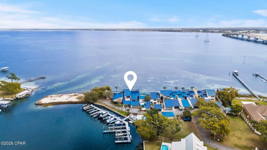 Welcome to 425 Bay Shore Drive, Unit 11, a remarkable waterfront residence in the heart of Panama City Beach, Florida. This exceptional property offers a rare opportunity to own a bayfront home with direct access to the serene waters of the bay, complete with a marina and an assigned private boat slip. Spanning 2,306 square feet, this residence combines spacious living with the tranquility of coastal living.

Upon entering, you are greeted by an open and inviting floor plan that seamlessly integrates the living, dining, and kitchen areas. The expansive windows throughout the home allow for an abundance of natural light and provide breathtaking views of the bay. The living area is designed for both relaxation and entertainment, offering ample space for gatherings with family and friends.

The kitchen is equipped with modern appliances and offers plenty of counter space and storage, making it a functional hub for culinary enthusiasts. Adjacent to the kitchen, the dining area provides a picturesque setting for enjoying meals while overlooking the water.

This home features two generously sized bedrooms, each with its own en-suite bathroom, ensuring privacy and comfort for residents and guests alike. The master suite is a true retreat, offering stunning water views and a well-appointed bathroom with modern fixtures.

An additional half bathroom adds convenience for guests, and a dedicated laundry area enhances the practicality of this residence. The property also includes a private boat slip, allowing for easy access to the bay and the Gulf of Mexico beyond, making it an ideal choice for boating enthusiasts.

Located in a desirable area of Panama City Beach, this home offers proximity to local amenities, dining, and entertainment options, while still providing a peaceful and private retreat. Whether you are seeking a permanent residence or a vacation getaway, 425 Bay Shore Drive, Unit 11, offers the perfect blend of luxury, comfort, and coastal living.

This property is a unique opportunity to own a piece of paradise in one of Florida's most sought-after locations. Contact us today to schedule a private viewing and experience the beauty and tranquility of bayfront living.