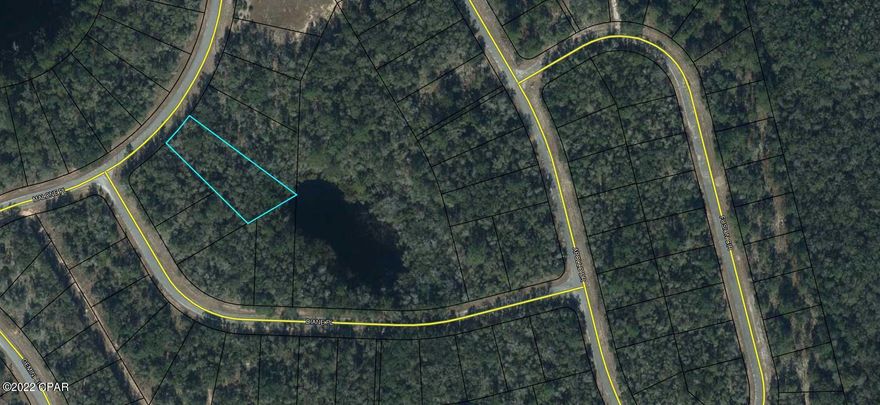 Oversized building lot in Unit 1 of Sunny Hills. This .54+/- lot is mostly wooded and possibly touches a small pond at the back of the property. Buyer to have a survey to verify. Lots are restricted to site built homes only. There are several fishing ponds/lakes in the area. Boat Lake for paid seasonal swimming. Approx. 45 minutes to Panama City Beaches and 20 minutes to Chipley for local amenities.