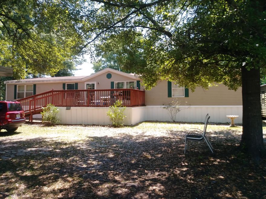 Spacious 4BD 2BA Home in the popular Deerpoint Lake area. Super quiet location at dead end of a short paved street. Large half acre yard with many nice oak trees.  Perfect for kids & pets.  Back yard is chain link fenced, plus has some additional privacy fencing.  Metal carport for covered parking.  Inside there is plenty of space, a living room and also a large den with a  fireplace, dining room plus breakfast nook.  Fully equipped kitchen, good-size laundry room with new water heater.  Bedrooms have roomy closet space.  Home is on County water  with a septic system. Metal storage building approx. 12x16 with oversized door to drive a riding lawnmower in. It's wired & ready for electric. Call today to see this great value!  Do not enter yard without appt, owners have dogs.  Thank you