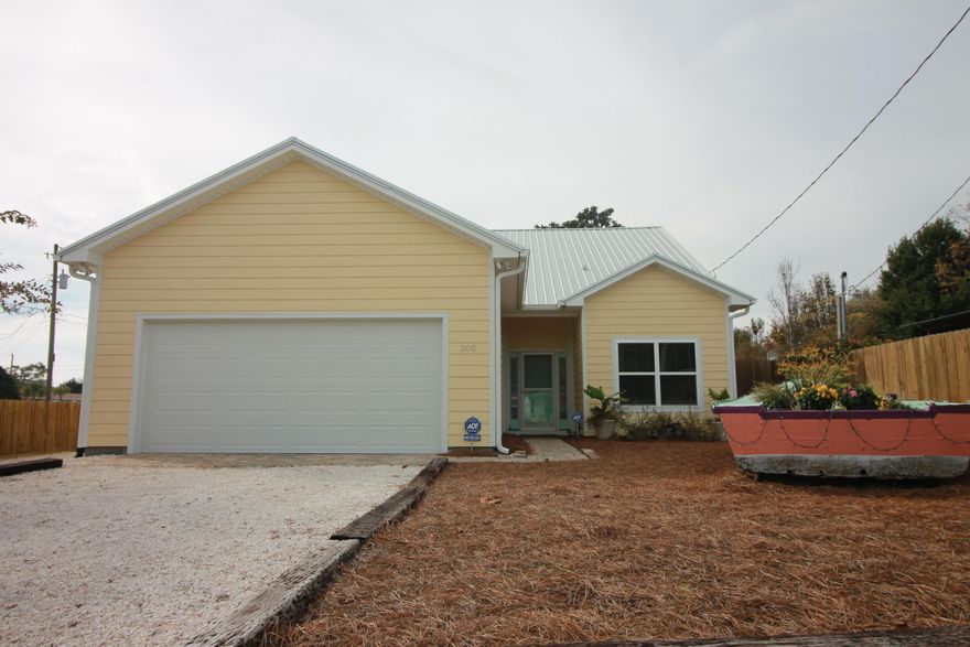 Beautiful 2-yr old custom home, 5-min walk to beaches. Hardy Board siding, metal roof, sprinkler, 8’ privacy fence, tankless water heater, foam insulated attic, 250 gal buried propane tank, outdoor shower. Woodgrain porcelain tile, granite counters, 36'' pocket doors & 10’ ceilings, w/ vaulted ceiling in living. French doors open to 437 sf. screened patio from living, dining, & master. Huge entertaining space, surround sound/patio speakers. Stained concrete patio w/ wet bar, gas starter WB fireplace, plumbed for a gas grill. Stainless appliances, gas range (+electric wired) & island. Master bdrm w/ gas fireplace, tray ceiling, walk-in closet, dual sink vanity, & large dual head shower. Guest suite is a 2nd master w/ deep soaker tub. Massive 603 sf. insulated 2-car garage w/ epoxy floor.