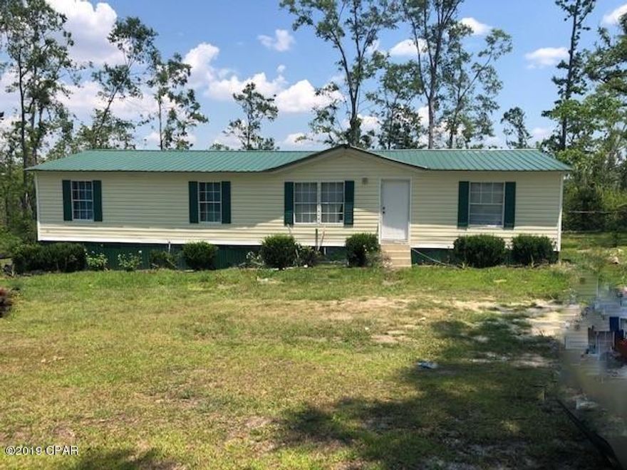 This is an exceptionally well maintained and updated triple wide mobile home in town.   It has nice kitchen cabinets with new granite countertops, new flooring, new doors, light fixtures, paint, bathrooms and new roof.  It features a split bedroom design and the owner has added the 4th bedroom.  You have a large living room with fireplace and a formal dining room.