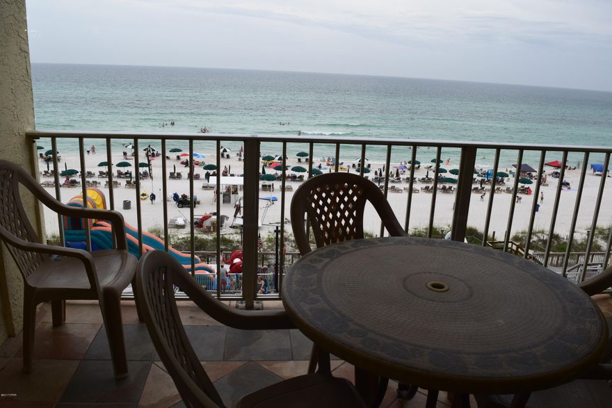 Recently renovated, this gulf front, rental ready unit is a great investment. Located on Thomas Dr., this popular complex offers 24 hour security, 2 pools, tiki bar, hot tub, game room, gym, kiddie pool. The balcony with direct gulf views is accessed from the living room and the the master bedroom. The beautiful floors are wood looking ceramic tile, the kitchen has new hardwood cabinets and granite countertops,  and the unit conveys furnished including the stackable washer and dryer.