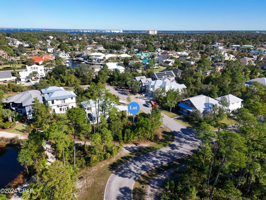 Prestigious Martinique, .2 acre vacant, building lot, twice as big as other lots, located on the East side of Panama City Beach.
Discover the perfect location to build your dream home in the sought-after gated community of Martinique! Privacy with no neighbors on three sides and serene pond-front views.
Martinique is known for its amenities, including a community pool, scenic walking trails and natural paths, a basketball court, children's playground, park pavilion, and gazebo. Golf cart-friendly neighborhood offers luxury and convenience.  
Location is everything, and this lot is just a short stroll from Captain Anderson's, Grand Marlin and Lighthouse Marina, offering world-class dining and waterfront activities. It's also just minutes away from Bay Point Golf Course,  St. Andrews State Park, pristine beaches, fishing, outdoor adventures.  
Seize this rare opportunity to design and build the custom home you've always envisioned in one of the most desirable areas of Panama City Beach and your chance to own one of the best lots in Martinique. Bonus - recent survey available, located in  Flood Zone X (no flood insurance required)
Tour today to make it yours!