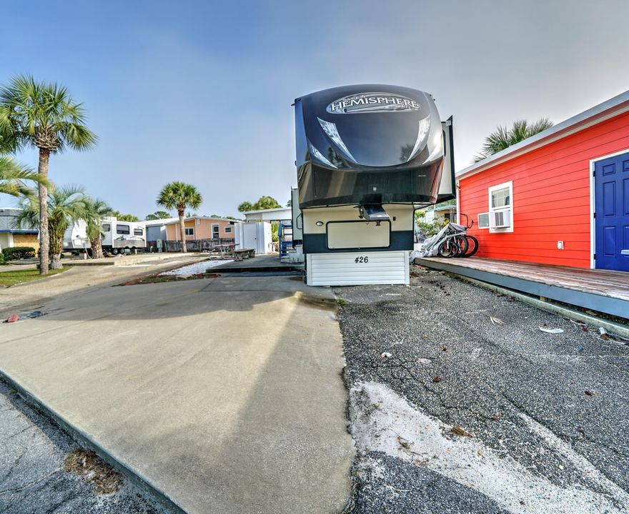 Check out this beautiful lot in highly sought after Venture Out.  This lot will come with a 41' 2014 Salem Hemisphere 5th wheel complete with 4 Slides and awning. 5th wheel has nice size master with on suite and a cool bunk room. There's also a 1/2 bath of the kitchen. Great central location within the resort. Build your dream home or hang out in the 5th! This one won't last long! Venture Out offers BOTH beach and bay access! The resort also has 2 pools, tennis, golf, shuffleboard, playground, basketball, fishing pier, boat dock with slips & boat ramp. Venture Out is a golf cart community that has exploded in popularity within the last few years. A gated, pet friendly community that's great for full time residency or just to vacation. 24 hour security & friendly atmosphere. It's all her