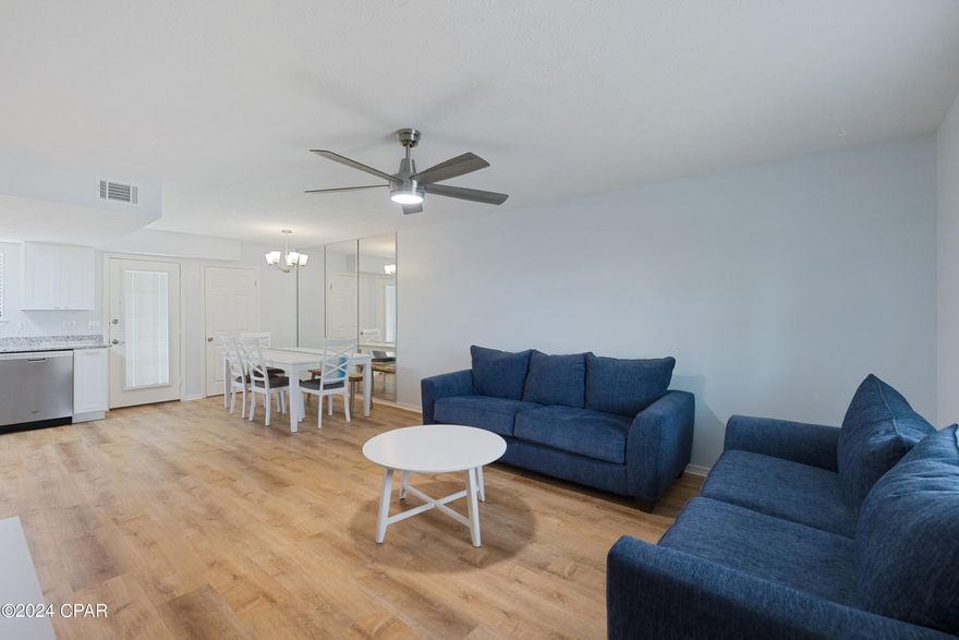 Beautiful, Well maintained townhome.  Immaculate condition.  The Seller's have owned this home for over 15 years.  This home has been recently remodeled on the inside and out.  New Paint inside and out. New architectural roof installed in June 2023.  New Deluxe vinyl flooring down stairs and hardwood flooring upstairs.  Brand new kitchen appliances, with upgraded deluxe gas stove and microwave, which has a 10 year warranty on each.  Top of the line granite countertops with a deep stainless steel sink and and a stainless steel refrigerator with a large freezer, Also the dishwasher is only 2 years old and is stainless steel.  There is also a laundry room and an instant-on hot water heater.  The downstairs bath has a 1 piece cultured marble countertop and a shiplap accent wall.  The stairway also features a shiplap siding wall for low maintenance and the upstairs has 2 full baths and 2 bedrooms.  with hardwood flooring.  They are tastefully decorated and the ceiling fans both upstairs and downstairs are remote controlled.  The complex is gated, with security and security lights at night and has 11 swimming pools, (One across the street behind the beach house) on the Gulf, 4 tennis courts. (2 lighted at night), a 2 acre miniature golf course, and 3.2 miles of wide street area perfect for walking, jogging or just driving your golf cart.  The complex has short term and long term rentals.  If you are looking for a ''LIKE NEW'' townhome with no immediate repairs, please view this unit before you buy.