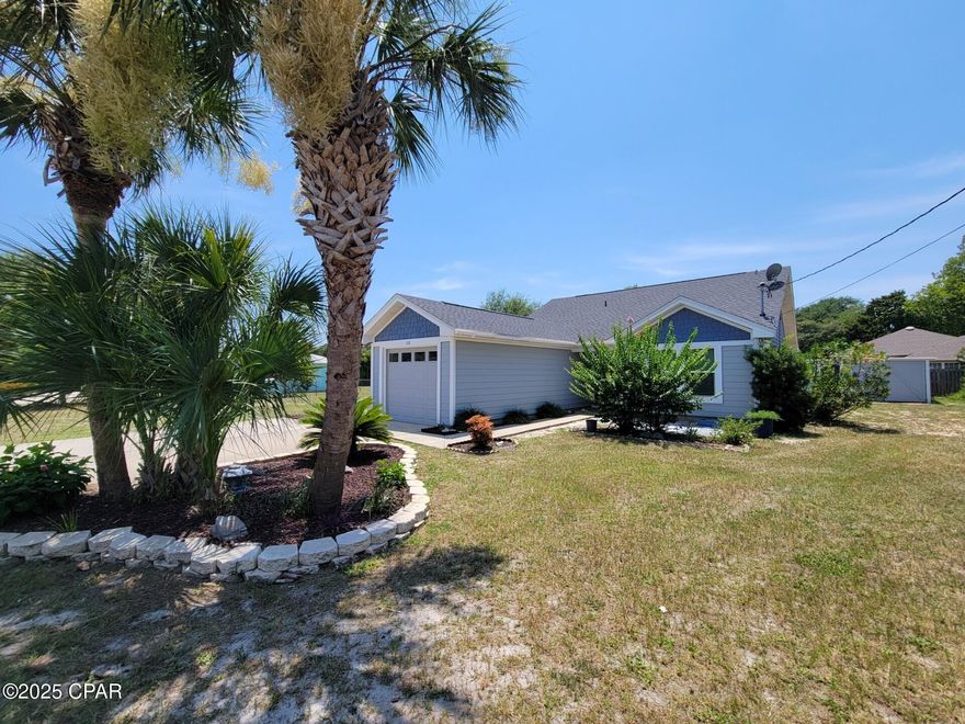 *Price Reduction* Welcome Home!! This Beach Bungalow+Buildable LOT has everything you need! Updated floors, Hardi plank siding, Fresh paint, NEW Roof and Hurricane windows! Walk-in pantry. Washer and Dryer Convey. Glassed in Florida room. Garage. Full rear workshop, additional garage AND a BUILDABLE double LOT perfect for a pool or to build up-to a triplex for rental income!! NO HOA. Located across from Legacy Golf Club and 10-minute walk or short Golf Cart ride to ''The World's Most Beautiful Beaches''!