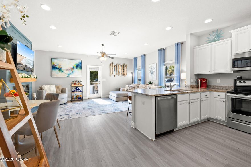 Corner-unit perfection with pond views and room to breathe. This immaculate end-unit townhome sits on an oversized lot with a large side yard, backs to a peaceful pond, and features designer touches throughout—including a shiplap fireplace feature wall and flexible under-stair space perfect for storage or a pet retreat.
The main living area features 9-foot ceilings, an open and inviting layout, and Weathered Barnwood luxury vinyl plank flooring throughout. The living room is anchored by a shiplap-accent wall with a cozy fireplace, creating a warm focal point that elevates the space. The kitchen showcases crisp white cabinetry, granite countertops, and flows effortlessly into the living and dining areas—ideal for both entertaining and everyday living.
Tucked neatly under the staircase is a clever flex space that can be used as additional storage, or even a custom pet retreat, a thoughtful bonus rarely found in townhome living.
Upstairs, the spacious owner's suite includes a large walk-in closet and a beautifully finished en-suite bath with a double-sink vanity and tiled shower. The secondary bedrooms are generously sized and share a well-appointed full bath.
The 51 x 95 lot provides ample room to expand the fenced area and enhance outdoor living. Located in the desirable Waterfall Townhome community, residents enjoy a community pool, all while being centrally located near shopping, dining, excellent schools, and just minutes from the Most Beautiful Beaches in the World.
This home truly stands apart, corner location, pond views, designer finishes, and flexible living spaces make it a standout opportunity.