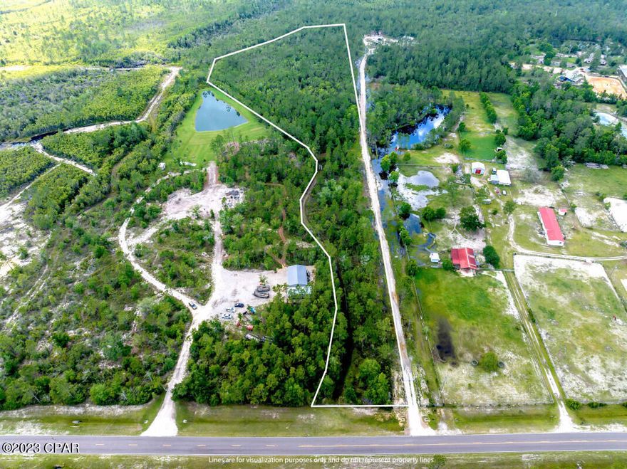 Located in Panama City, FL, this 10.30-acre land offers an ideal opportunity for building a secluded home with captivating views from its elevated position. Land has excellent potential as a hunting tract. Electric connections are available, while the installation of well and septic systems is necessary. Annual tax only $951. Zoned A2.