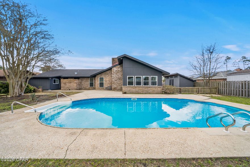 Beautifully positioned canal-front home in NorthShore with approx. 110 feet of canal frontage, this property offers direct access to Goose Bayou, North Bay and the Gulf.--ideal for true coastal culture. An opportunity to customize waterfront living. Open-concept layout.
The residence features 4 bedrooms and 2.5 baths, including a flex room conveniently located just inside the entry from the drive-through garage, opening on both sides to create a porte-cochère style arrival and exit. The front courtyard, secured by an iron gate, provides a charming and private welcome.
 Enjoy the Florida room, In-ground pool, overlooking the dock and canal as well as a detached art studio/ creative retreat. 
This Lynn Haven waterfront home is ready for its next chapter and offers an exceptional opportunity along the Emerald Coast.

(Buyer to verify all dimensions, measurements, fees & written information).