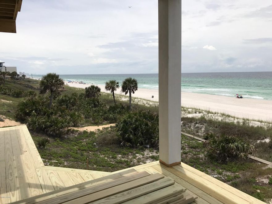 Why pay 30A prices when you can experience the same beautiful beaches and gulf views for millions less! This new gulf front home is the furthest westerly located home under construction on Panama City Beach (outside of Carillon Beach). This home sleeps 22 and will be 6 bedrooms, 6.5 baths, 3,512 sq. ft. of open living space, and 2nd and 3rd story covered porches that total 956 sq. ft. This home is being sold fully furnished and ready for rentals with a projected rental income of $220,000. Some interior features will include tile floors, large kitchen with open floor plan that has ample space to accommodate family and friends, custom cabinets, breakfast bar, vaulted ceiling, owner closet, and hallway bunk beds. The gulf facing master bedroom allows you or your renters to wake up, roll over and experience a breathtaking view of paradise. Master bath has a whirlpool tub and separate shower. Come enjoy taking a dip in your own private heated pool as the ocean breeze flows over you. 2-2 Ã‚Â½ ton HVAC units, covered carport with plenty of parking, spray foam installation, high elevated lot and protected concrete seawall. This home is within 2.5 miles of Inlet beach, 3.5 miles to 30A, and less than 5 mins from Rosemary beach making this the perfect location!