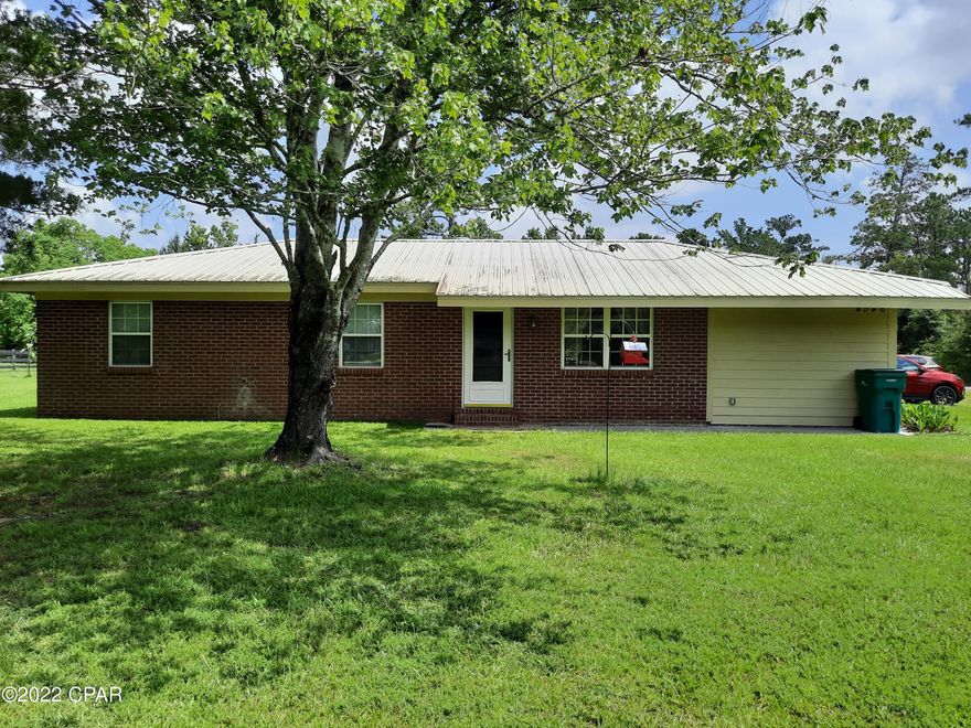 BRING YOUR HORSES!! 2 Bedrooms 1-1/2Baths Country Home already fenced. Plenty of room for a garden. Some of back yard fenced for Dogs.  20X24 Utility Building, plus Barn.  Huge Deck on Back for grilling and entertaining. New double pane windows and AC/Heat Pump unit in 2018.  Kitchen upgrades with Black Stainless Appliances, Kitchen Cabinets with Coran Countertops. All Tile Flooring. Sliding Barn Doors leading into Bathroom and Oversized Master Bedroom. Spacious Laundry Room. Ceiling Fans.