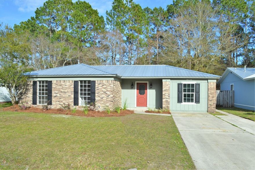 ATTRACTIVE HOME NEAR TYNDALL AFB! - 3 LIVING AREAS!! The interior of this move-in ready home features 3 bedrooms, 2 bathrooms, an open floor plan, new high quality laminate wood flooring, new fixtures, a spacious family room, an open living room, a bright sunroom and a brand new kitchen. The kitchen boasts new stainless steel appliances, beautiful granite counter tops, new cabinets with soft close drawers and is open to the dining area and 19x12 living room.  The 19x11 family room has brand new carpet. All bedrooms have tall windows and new carpet. Both bathrooms have new fixtures, new tile flooring, new toilets and new vanities with granite tops. The master bath has a walk-in shower with dual shower heads. The exterior features a privacy fenced backyard, a side patio, a covered front porch and new landscaping.  NEW: Metal Roof, HVAC, Water Heater, Flooring, Paint, Fixtures, Kitchen, Appliances, etc. Located near schools, shopping, restaurants and only MINUTES to Tyndall AFB! Call today for your own private preview. All information derived from public record and owner; buyer to verify. Measurements approximate.