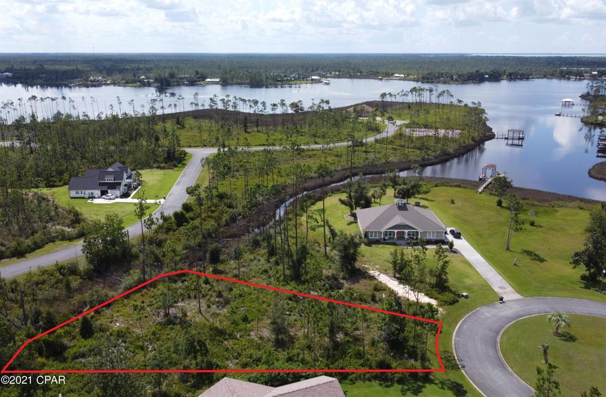 Amazing home site in the desirable Laird Bayou. Plenty of space for a custom build. A two story home should get you water views of Laird Bayou and East Bay. Laird Bayou is a gated waterfront community that features underground utilities and ribbon curbed streets. Amenities include private boat launch, Rv/boat storage, pool, bathhouse, and mail kiosk. Launch your boat in the community and enjoy the beautiful waters of East Bay or just a short boat ride to the Gulf of Mexico. Full service marina just minutes away for fuel and ice. Great proximity to TAFB, Mexico Beach and Panama City Beach. Schedule your private tour today!