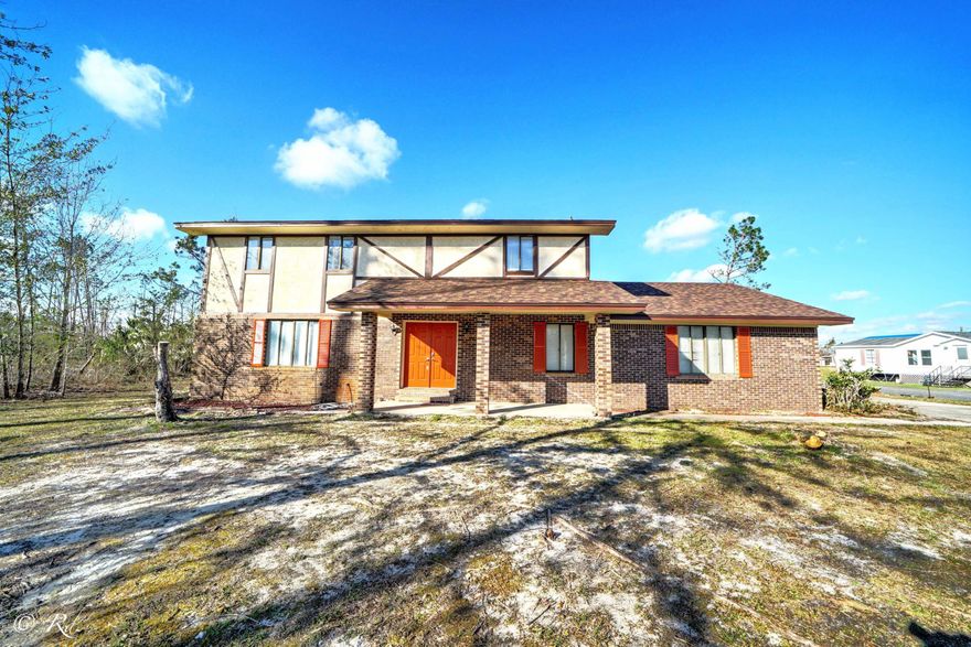 Move-in ready 4 bed 2.5 bath home!  Home was renovated 2016-2017 to include new tile in kitchen and dining, new kitchen cabinets and Corian counters, new black stainless LG appliances, new paint, new carpet, vanities, toilets and light fixtures upstairs. Hurricane damage has been repaired including new roof Dec 2018. Downstairs features living/dining/kitchen area plus a den with fireplace. Upstairs has 4 large bedrooms and 2 baths.   Country living on .67 acres and still close to Panama City and Tyndall.