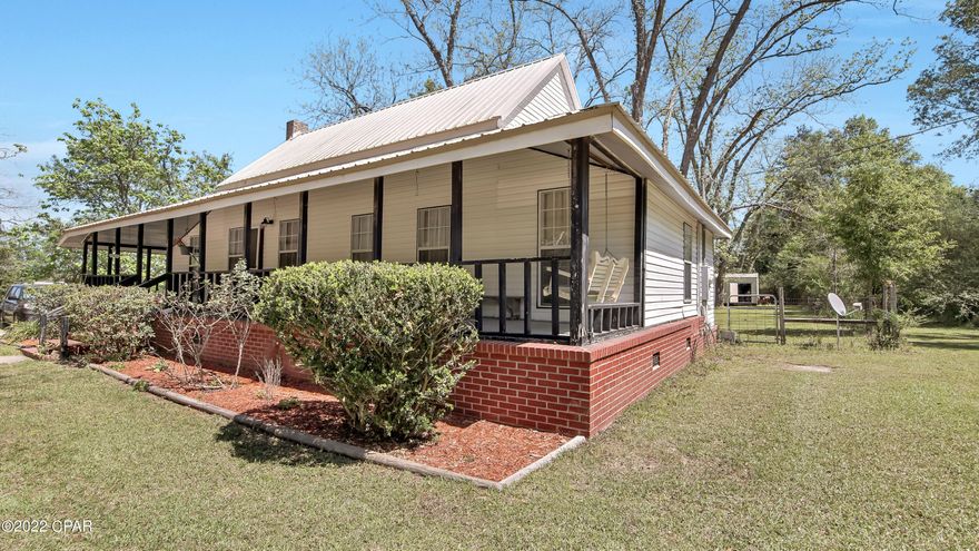 Southern Charm. This quaint 1 Bedroom 2 Full Bath Home, that could easily be a 2 Bedroom, sits nestled on a beautiful 1 Acre Lot. This is the quintessential Southern Style Farm House, featuring full length covered front porch, original hardwood floors, wood burning fireplace, and Dutch Gable Roof. Inside, features include shiplap walls that blend and mesh with the original (now antiqued) wooden walls. The Master Suite features a built-in wardrobe with drawers, double pedestal sinks, and walk-in shower. The kitchen area offers ample countertop and cabinetry space, and flows perfectly into the dining room that hosts a large stained glass trimmed window. On the opposite end of the kitchen is the 2nd full bath that opens into the large bonus room with laundry. Outside the property offers a large, fenced in backyard and oversized yard building with rollup garage door. This charming home has so very much to offer, so schedule your showing today!