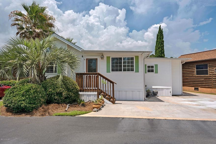 This home is quite possibly the cutest and most desirable in the entire neighborhood. Appropriately named Turtle Pond, this home sits directly on the lake in Emerald Pointe and offers 3 bedrooms, 3 full baths and 1,299 sq ft of living space. The Seller started with the standard 388 sq ft Park Model and added 911 sq ft of stick built construction including a huge living area, 2 bedrooms and 2 full baths. The open floor plan is ideal for preparing dinner and socializing with your family and guests or for looking out at the beautiful lake with boardwalk. The kitchen area, baths and hall have Mexican tile floors and the living area and bedrooms area carpeted. The master bedroom even has a private deck with outdoor shower! A special plus is that this home is beautifully decorated and More...