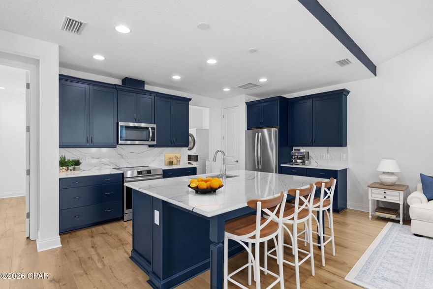 Discover Paradise in Latitude Margaritaville Watersound - Camellia Conch Cottage Now Available!

The Camellia is the second most affordable floor plan in the highly sought-after Conch Cottages Collection at Latitude Margaritaville Watersound. 

This charming 2-bedroom, 2-bath cottage offers 1,315 heated and cooled square feet, a spacious 149 sq ft porch perfect for relaxing, and a generous 410 sq ft 2-car garage.

At the heart of this home is a stunning kitchen featuring decorative quartz countertops and backsplash, an upgraded induction glass cooktop range (added after closing), and elegant Admiral 42'' upper cabinets finished with crown and valance molding. The extended island provides ample space for seating that tucks away neatly, seamlessly transitioning into a buffet for entertaining.

The dining room includes a stylish ceiling fan with wall switch instead of a standard light fixture, allowing easy conversion into an open den or flex space for ultimate versatility.

Enjoy exceptional light control and privacy with expandable, adjustable-height blinds in the living room, dining area, and primary bedroom—these innovative blinds let you maximize natural daylight while maintaining total or partial seclusion.

The primary bathroom is a true retreat, complete with tile flooring, granite vanity countertops, a luxurious floor-to-ceiling tiled shower, grab bars for added safety, seamless glass enclosure, and sophisticated rubbed oil bronze fixtures.

Additional thoughtful upgrades include a laundry room with lower cabinet, folding countertop, and stacked washer/dryer, plus a garage featuring a utility wash sink and durable epoxy flooring.

Latitude Margaritaville Watersound is a vibrant 55+ active-adult community inspired by the laid-back, fun-loving spirit of Jimmy Buffett. Enjoy true resort-style living with multiple pools, state-of-the-art fitness centers, on-site dining, entertainment, pickleball, bocce, and endless opportunities to make new friends and live the island life you've dreamed of—right here on Florida's beautiful Emerald Coast.

Ready to make your escape to paradise? This move-in-ready gem won't last long—schedule your private showing today and start living the Latitude lifestyle!