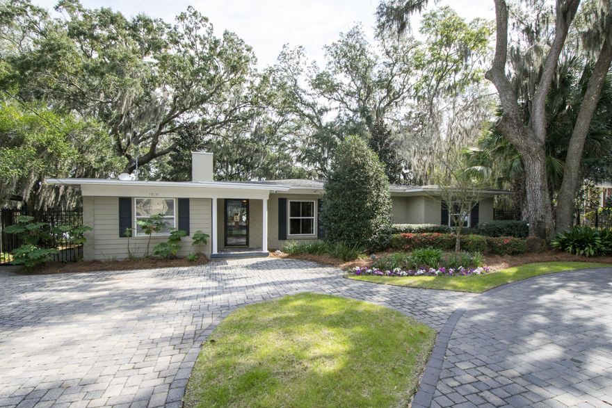 Fabulous waterfront home in The Cove that is full of upgrades inside and out. With 100ft on the water, this home is an entertainer's delight. There's a private sandy beach and a lower party deck overlooking the water. The dock, which includes 2 boat slips, was widened with 2x Trex board so that you can drive a golf cart right out to the boat. The dock is complete with a fish cleaning station including power and water. A new 10,000lb lift was just installed. There's a separate shed that houses all the boat gear and tackle. Aluminum remote gates on each side of the house keep everything secure and protected. Circular paver drive in front and extensive landscaping throughout this gorgeous property. The inside has also been extensively renovated including a custom kitchen with maple cabinets. There's a custom wine and beverage wet bar overlooking the backyard and water. A wood burning fireplace is nearby along with hardwood floors throughout. The owner has truely thought of everything and created a "mud room" that's nearly 150 sq. ft. to isolate the saltwater activities. This room is complete with a walk-in shower. The master suite overlooks the water and offers a bathroom fit for a King. The roof is 6 years old, a 500 ft deep well was added, blown in insulation, 2 new heat pumps, the list goes on and on. It is truely a turn-key property. Make an appointment to see this one today.