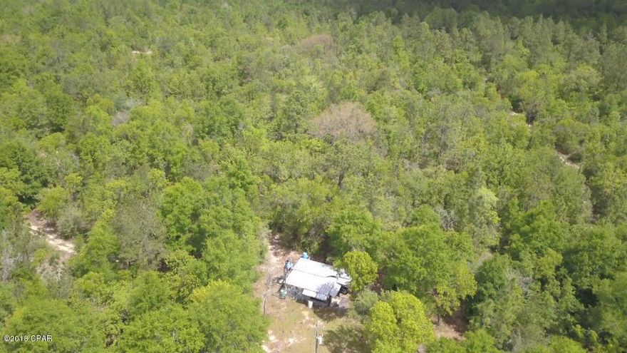 Vacant wooded land just 1.6 miles off Hwy 231. Property has a campsite already set up and electricity is ran to the site. Great place for a home or private getaway.  Lots of potential here. Some trails established.  If you have always wanted your own land or want to add to your portfolio this is it.  Only about 40 minutes to Panama City Mall.