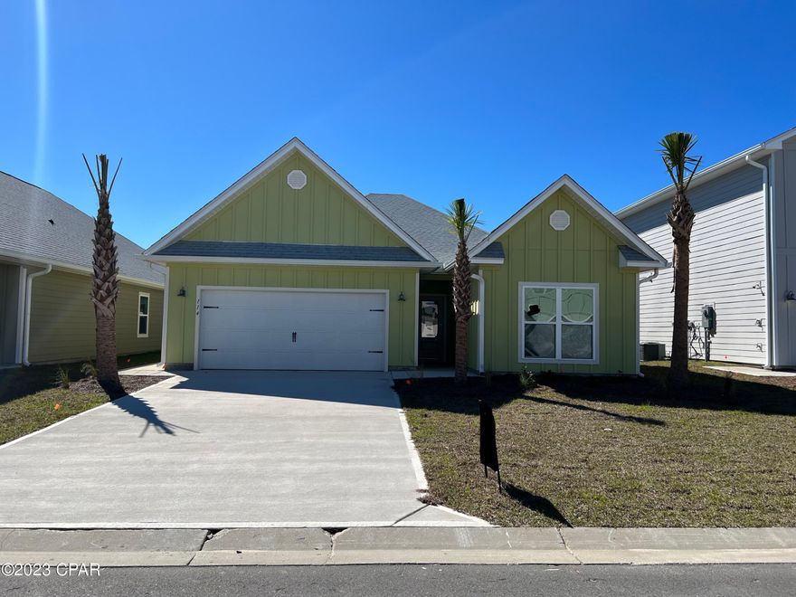 The Kenney is a 4-bedroom, 3-bath home with just under 2,200 square feet of living space located in WindMark Beach. Unique to the Kennedy is an entire second living space, or mother-in-law suite. This section includes a separate exterior entrance, separate air handler, separate washer/dryer hookups, and kitchen. Standard features of this home include beautiful quartz countertops with undermount sinks in both kitchens and all bathrooms. EVP flooring throughout the entire home, 9-foot ceilings throughout. Stainless steel appliances included in both kitchens are a free-standing smooth top range, microwave, and dishwasher.  This home also includes a disposal and water filtration system in the Kitchen.  WindMark Beach is a tranquil community where one can enjoy the natural settings with boardwalks, walking paths, bike trails, and deeded beach access. WindMark Beach also offers residents numerous luxury amenities and features including a community pool, a gym, restaurants, packaging store/bar, beach equipment rentals, community fire pit, local shopping, and a versatile community center. Images, descriptions, SF and room sizes are approximate.