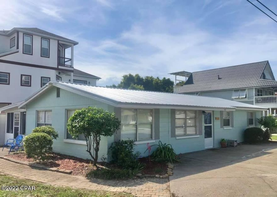Amazing Opportunity for Vacation Rental, Second Home or Primary Residence.  This charming concrete block beach cottage is conveniently located in the highly desirable Riviera Beach area on the West end of PCB.  30A is to the West and Pier Park is a short 5.5 miles to the East.  Walk, ride your bicycle or take a golf cart to the Public Beach Access # 87, 88, or 89.  Home features three bedrooms, two baths on a corner lot.  Some recent upgrades include a new metal roof in 2021, stove in 2015, new HVAC and water heater 2016, new sliding door and two screen doors 2017, renovated and expanded master bath, washing machine and refrigerator replaced in 2019.  *all important listing information should be verified.