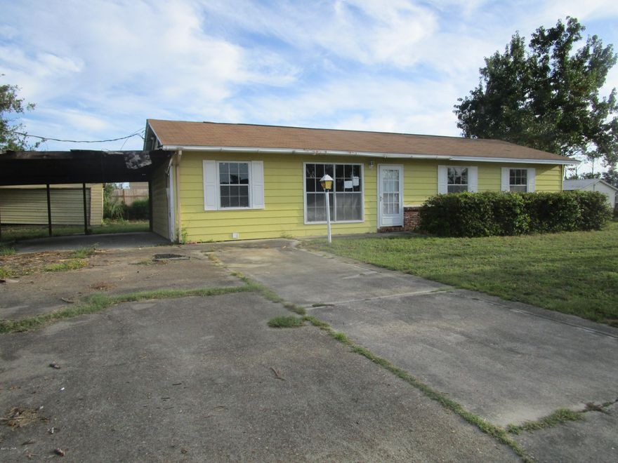 Solid home conveniently located between the City and the bridge to the beach!  This home features a living room, dining/kitchen combination with a nine square foot pantry, three good-size bedrooms and a half bath off the Master bedroom.  There is also a Den and separate laundry room.  Outside is a carport, detached garage and a storage building.  The home will need updating and the exterior requires some repairs, but it has great potential!