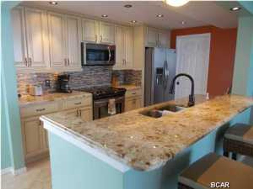 INVESTORS!! LUXURY INVESTMENT. This must see 1-of a kind custom 2 bed/2 bath condo at Long Beach resort! Origninal floor plan has been redesigned to give the owner a walk around custom kitchen with awesome views. Kitchen has all new stainless steel appliances including a built in wine/ beverage cooler. New travertine floors throughout! This unit has 2 Master bedroom suites which are both located on the Gulf! Both bedrooms have balcony access and have floor to ceiling windows! Too many upgrades to list. Open living area with floor to ceiling glass also. Long Beach Resort has 3 pools, one of which is a beautiful lagoon style pool with waterfalls, plus 3 hot tubs! On rental program. For the Investor buyer this condo's 2013 GRI $44k+, 2014 first 8 months GRI $38k+, 2015 GRI projection