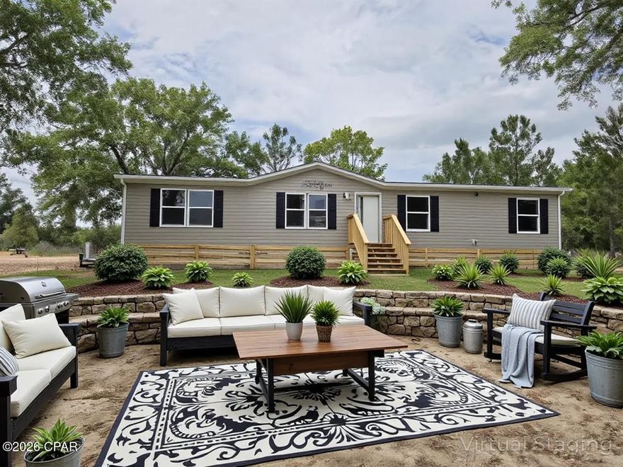 Brand-new 2026 manufactured home on over an acre in the scenic Compass Lake in the Hills community. This spacious 4-bedroom, 2-bath home offers a bright, open layout with modern finishes and a 10x20 covered deck at the rear--perfect for outdoor living. It comes with a one-year manufacturer warranty for peace of mind. Surrounded by wildlife and lakes, residents enjoy a welcoming community featuring a clubhouse and a wide range of amenities. Very affordable living, with community dues starting as low as $135 per year.  Some photos are virtually staged.