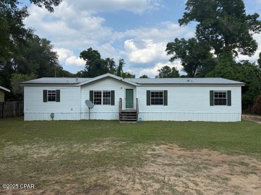 CURRENTLY UNDER CONTRACT, SELLER WILL CONSIDER BACKUP OFFERS.  Shuler Lane Bristol, FL—a spacious 4-bedroom, 3-bathroom triple-wide mobile home nestled at the end of a short road in the heart of Bristol. This beautifully updated home features fresh paint and new flooring throughout, offering a modern and inviting atmosphere. The expansive layout provides ample space for family living and entertaining. Outside, a large three-bay pole barn offers versatile storage or workshop space, perfect for hobbies or equipment. Centrally located in Bristol, this property combines rural tranquility with convenient access to local amenities. Don't miss this move-in-ready gem—schedule your showing today!