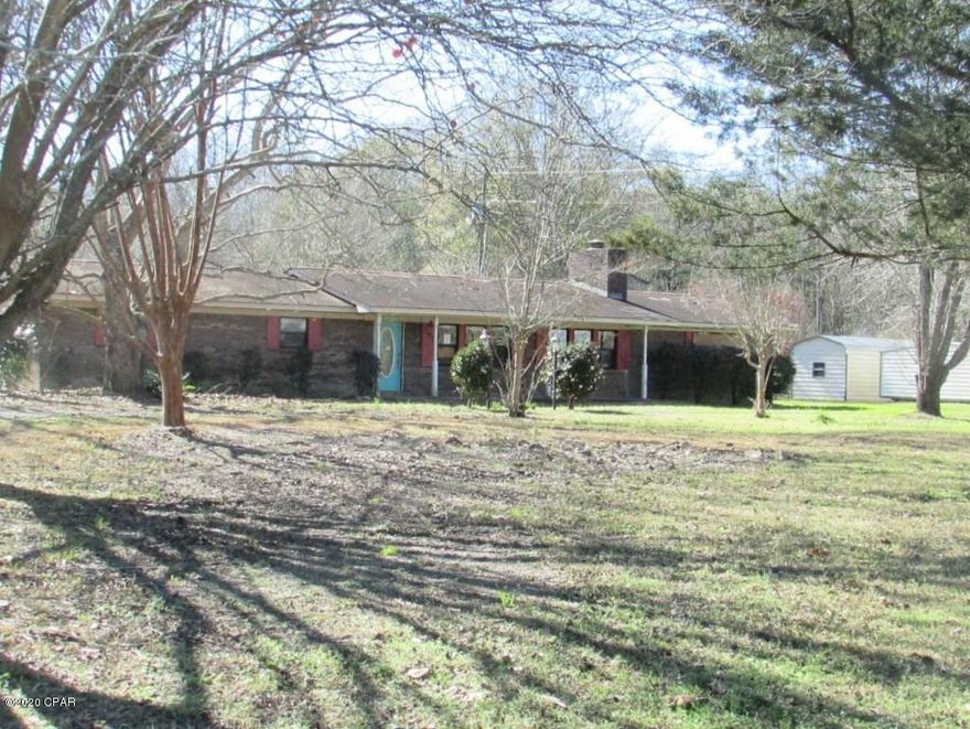 Large Family home in Graceville. This Brick home has an open floor plan with 4 Bedrooms, 2.5 Baths with 2490 sq ft on 2 acres! The kitchen has plenty of cabinet space, granite countertops. Beautiful stone woodburning fireplace in the living room. Home needs work but can be made into the perfect home for your growing family! Screened pool area and workshop! Possible mother in law suite. The yard is spacious with plenty of room for all of your families hobbies! This home will not qualify for FHA/VA financing. Renovation loans only. Call today for more information on home and loan options.