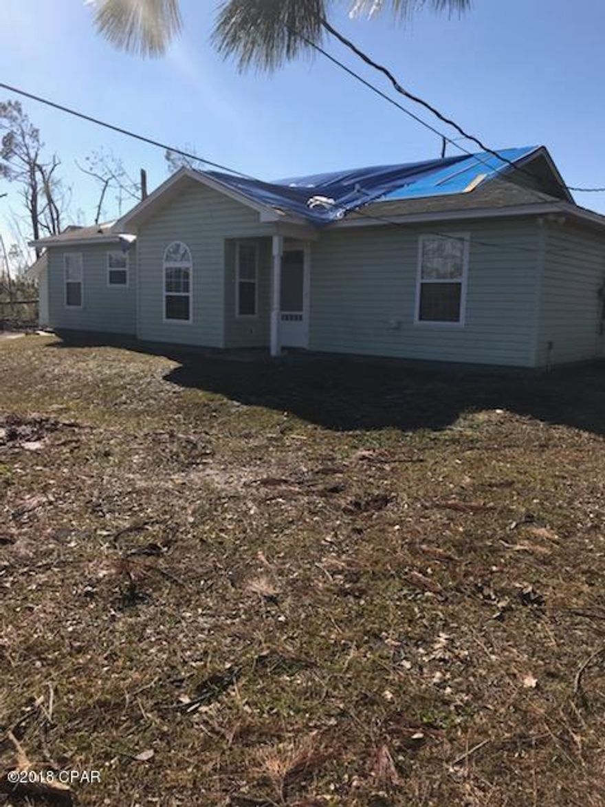 Very nicely maintained on .75 acres of land.  Nice 3BR 2BA home that has been lovingly taken care of.  The vaulted ceiling make the living and dining rooms feel very spacious.  The kitchen has a convenient office tucked away on the side.  The laundry room has a stainless steel laundry sink and also a drop down ironing board. All appliances (including washer and dryer) will stay with the home.  The home sustained very minor roof damage during Hurricane Michael and will have a new roof put on (contract has already been signed).  .  There was no discernable interior damage. The home did not take on water.  There is a detached  garage with workshop.  There is a 30 amp outside RV outlet.