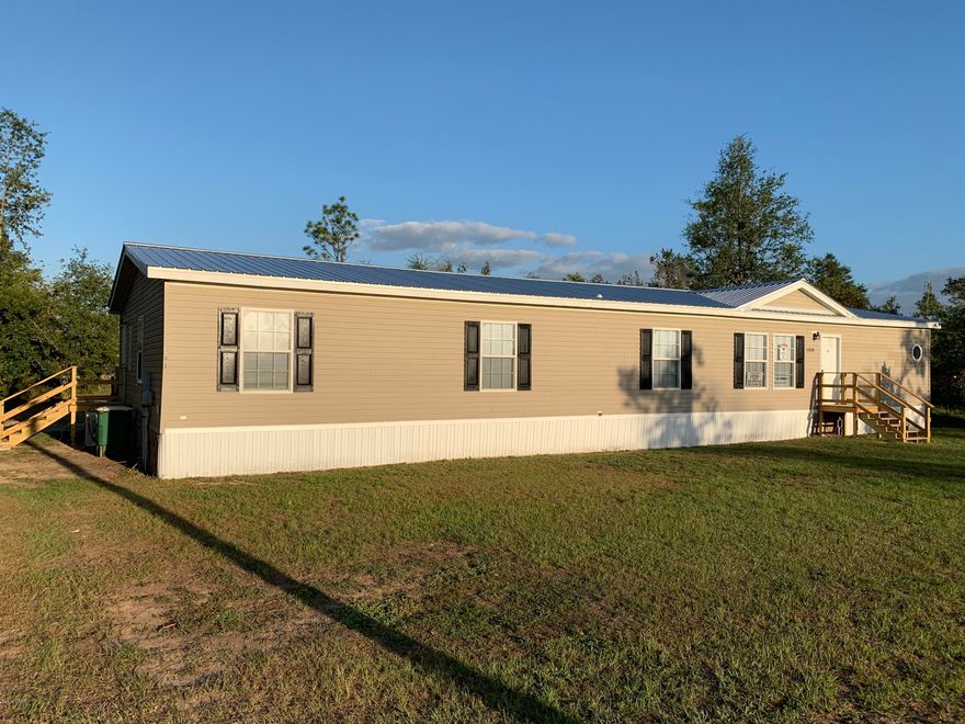 FOR SALE - Spacious 4 bedroom, 3 full baths. Huge eat in kitchen with lots of cabinets. Master suite has bonus room, hers and his walk in closets, double vanities and shower. Recently updated with new flooring, fresh paint and brand new central heat and air conditioning.  This home is in move in condition. (needs stove and refrigerator)  Located just off of hwy 231 on just over 1/2 acre with partially fenced back yard. Several financing options available including Fha, VA and possible seller financing available. Contact an agent for complete details and easy viewing instructions.