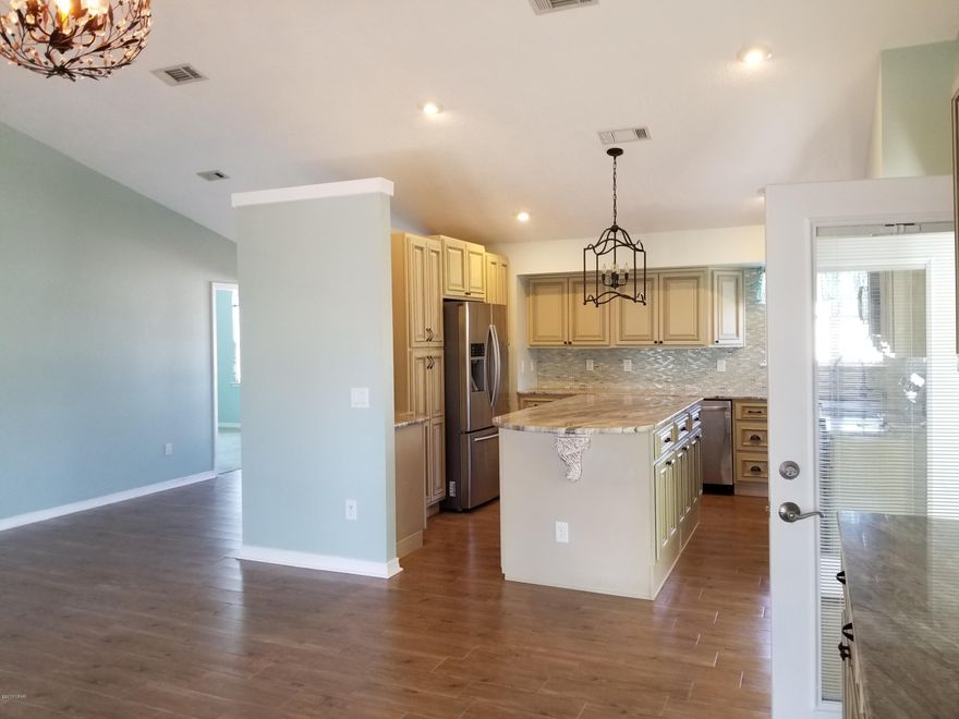 A ''JEWEL'' is the best way to describe this home snuggled in the middle of well sought after Bid A Wee Beach with its own Private Beach Access. This beautiful 3 Bedroom 2 Bath home with added on Sunroom is over 1700 sq.ft. So many upgrades have been done: All new flooring, Sunroom has Travertine floors, Bathrooms with Tiled Shower/tub, new counters/cabinets, new carpet in all bedrooms, Spacious Kitchen fully equipped with tiled counters, breakfast bar, Interior painting, A/C, Hot Water Heater and Metal Roof. Other features are: Raised Ceilings, Screened in back patio, Gazebo area in Fenced in back yard and Large Front patio area. Owners take pride in this very well maintained Home. Close to the Worlds most Beautiful Beaches, Pier Park, Shopping, Dining and Frank Brown Park