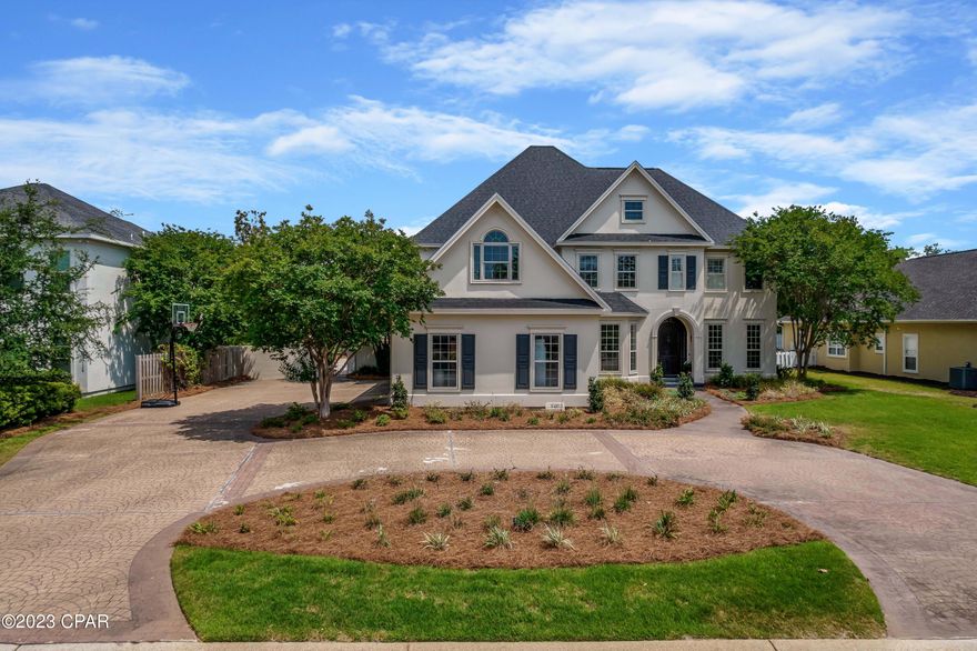 CURRENTLY UNDER CONTRACT, SELLER WILL CONSIDER BACKUP OFFERS Simply stunning! This home has been completely remodeled, down to the studs, including walls moved and adding square footage, all custom with exquisite details.  Gorgeous new white oak hardwood floors in a beautiful herringbone pattern, new kitchen, all new bedrooms and baths, new screened in outdoor living space, newly redone pool and outdoor patio, new fixtures, almost everything is brand new, inside and out!  This is the home you have been waiting for with 5 bedrooms, 4 and a half baths, 2 kitchens, incredible screened in outdoor living room with fireplace, beautiful pool with spacious travertine patio, oversized lot with lovely large backyard, circular drive, and 3 car garage.  This home features 5 fireplaces, including 3 downstairs, 1 upstairs and a wood burning fireplace on your screened in outdoor living space.   The custom kitchen is a chef's dream, and perfect for entertaining large gatherings, as well as intimate for catering to smaller family gatherings.  Just a few features are La Cornue range and custom hood to match, custom cabinetry with built in china cabinet, coffee bar and walk in pantry.  To add to your dream kitchen, you have a separate butler's kitchen complete with double ovens, dishwasher and warming drawer.  The main kitchen is open to your living room with Belgian blue stone fireplace, wet bar with bistro shelves, built in storage cabinets, and custom tv cabinet with mirror doors.  The library features custom shelving and an American Victorian cast iron fireplace, and carved oak chandelier.  The sellers spared no expense adding a first-floor master bedroom with impressive master bath complete with stained glass window, and French colonial double doors leading into the custom closet.  Upstairs are 3 bedrooms, each with private bath, and bonus room with additional art room.  Bonus room may be used as the 5th bedroom; and could easily be turned into an upstairs master bedroom as it already has a complete master bath and fireplace, as well as spacious balcony.  The exterior of the home is lovely and has plenty of room for cars with a front circular drive, large side driveway and 3 car garage.  Step into the backyard where you have a spectacular patio perfect for lounging or entertaining, an inviting oversized pool, covered porch area for dining, expansive yard with trees, and a beautiful screened in outdoor living room with fireplace.  Enjoy the Bay Point lifestyle in this gated, waterfront community with brand new state of the art marina, golf, tennis, and close to shopping, dining and the beautiful white sandy beaches of Panama City Beach.  Call today for your private showing of this luxurious home. For more details on custom renovations, please see information sheet.