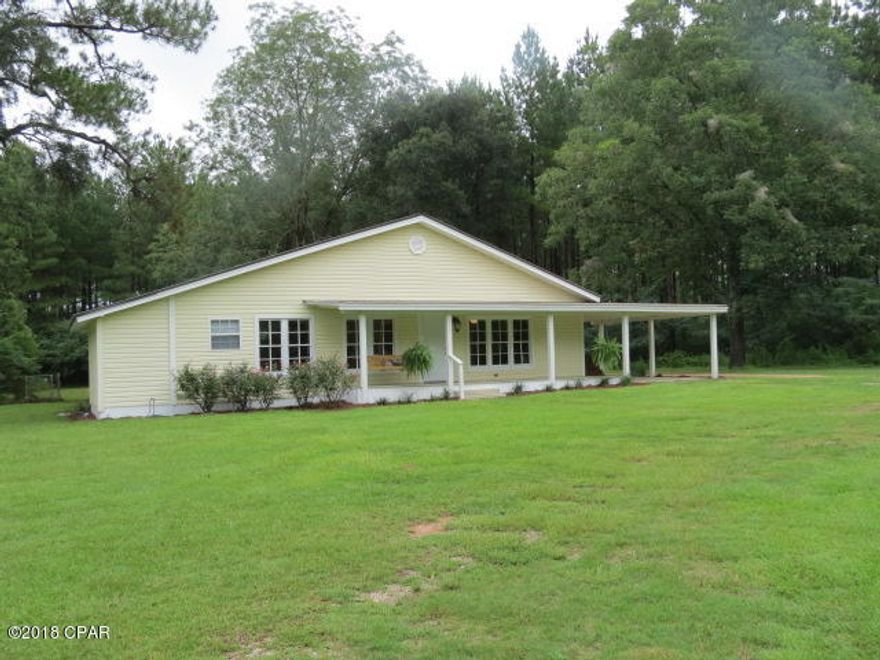 This Beautiful 3/2 remodeled home features hardwood, laminate, vinyl and ceramic flooring, new wiring, new plumbing, new stove and dishwasher, new sheetrock, new paint, new ceiling fans and lights, handicap bathroom. Master suite has a sitting room/office. Porch has new decking. All sitting on 1.47+/- acres. A MUST SEE! MAKE YOUR APPOINTMENT TODAY!