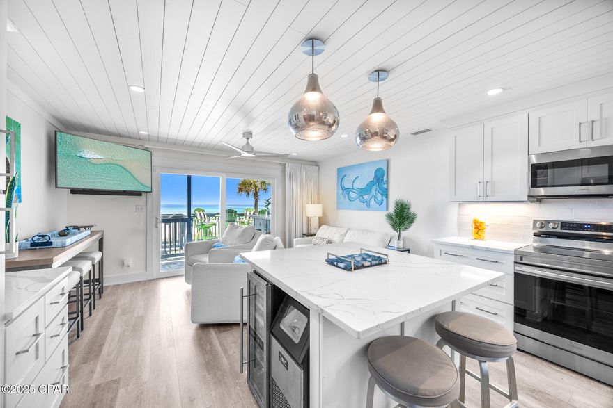 MAJOR PRICE IMPROVEMENT. Gulf-front, fee simple townhome in West End Panama City Beach, FL. Studs-out renovation for improved flow with new electrical and plumbing. STR-optimized layout lives like a 3BR/3BA: 2 bedrooms + custom bunk room, 3 full baths. Shiplap, LVP flooring, custom trim, upgraded lighting. Chef's kitchen with oversized island, custom cabinetry, wine fridge, ice maker, and walk-in owner pantry. Two balconies + massive Gulf-front deck with direct beach access. Sold turnkey, fully furnished. Investor note: may be eligible for 100% bonus depreciation on qualifying FF&E; consult CPA. Minutes to Pier Park and Northwest Florida Beaches Int'l Airport (ECP).

* Gulf-front revenue potential with 2 balconies, large gulf-front deck, and direct beach access.

This redesigned gulf-front townhome blends coastal style with thoughtful functionality. The reconfigured layout offers two large bedrooms, an additional bunk room, and three full bathrooms, including a custom-built bunk space created from the former kitchen to enhance rental capacity and efficiency. Luxury vinyl plank flooring, shiplap throughout, upgraded lighting, and custom trim elevate the interior. The expanded chef's kitchen includes custom cabinetry, wooden pull-outs, glass-front uppers, built-in wine storage, oversized island, a wine refrigerator, and a built-in ice maker.

A spacious walk-in pantry also serves as an ideal owner's closet. Featured in the three full baths are quartz countertops, beautifully tiled showers with niches (two with built-in benches), and a popular multi-shower-head system that delivers an all-encompassing, spa-like experience.

Full-time residents or second-home owners will appreciate the rare abundance of storage throughout the property, making seasonal decor or personal items easy to organize and keep out of sight. As a fee simple property, owners benefit from the security and flexibility of owning both the home and the land offering greater control, simpler future improvements, and stronger long-term value than typical condo ownership.

The primary suite opens to a full-length private balcony with sweeping Gulf views. Additional improvements include recessed lighting, hurricane-rated sliding doors, relocated full-size laundry, built-in bunk storage, and custom aluminum railing. Exterior features include two private parking spaces, storage for beach gear, an outdoor shower, and multiple outdoor living areas just steps from the sand.

Offered fully furnished with high-quality coastal pieces, this property functions beautifully as either a personal retreat or a high-performing short-term rental.